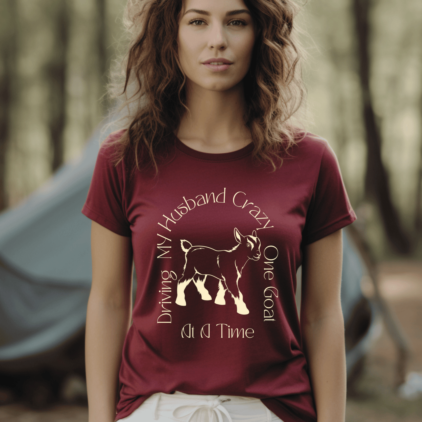 The saying Driving My Husband Crazy One Goat At A Time. with a cute outline of a baby goat on a crew neck t-shirt