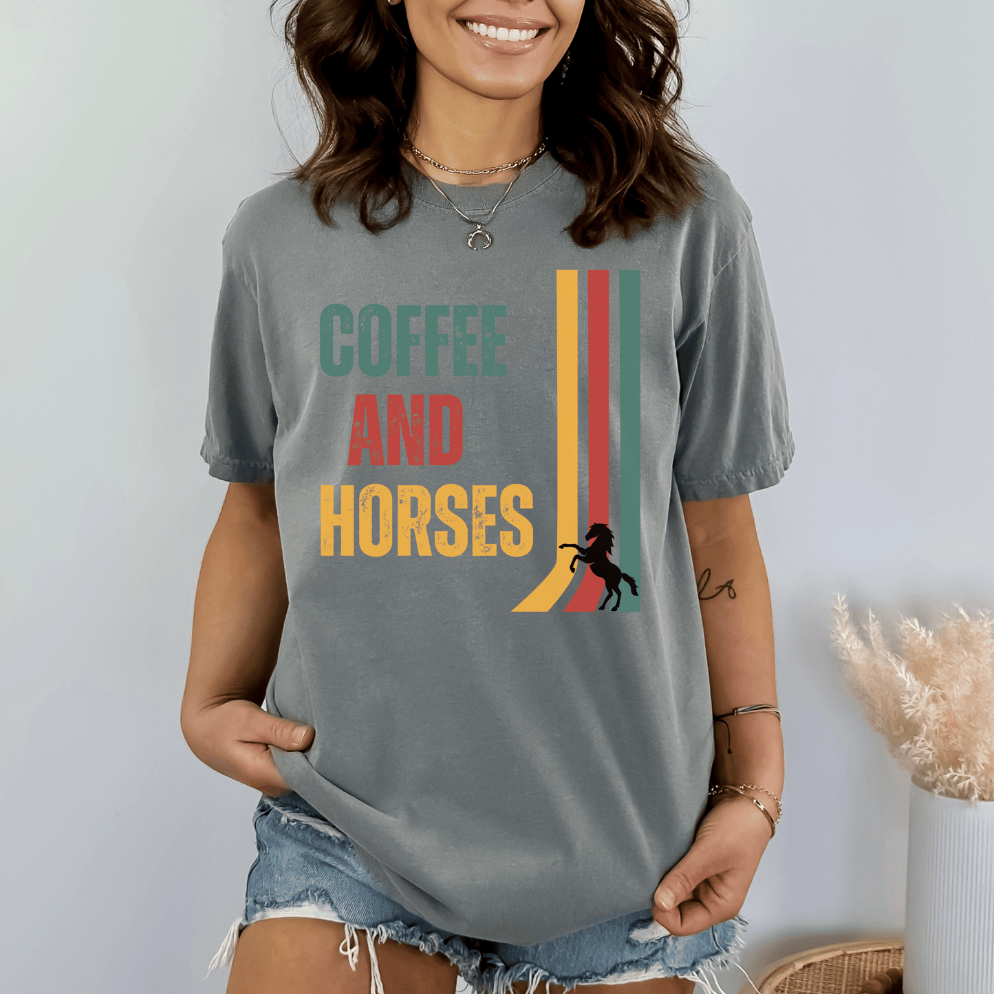 Graphic tee with the saying Coffee and Horses in a vintage font printed on a comfort colors tee.