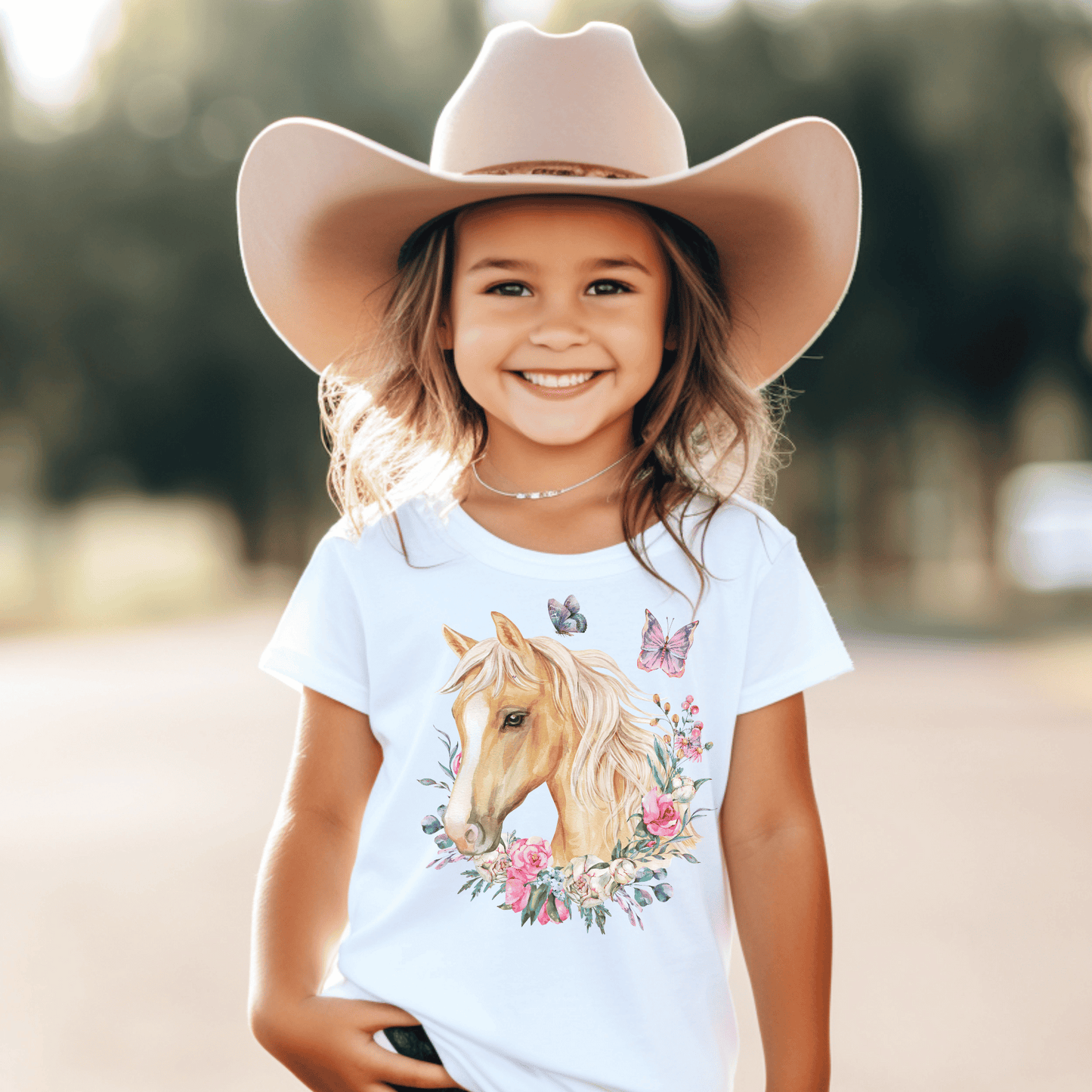 charming Youth T-Shirt adorned with a breathtaking Palomino horse, delicate floral motifs, and enchanting butterfly design. This fashion-forward tee will make your little one feel as graceful as a butterfly and as elegant as a Palomino horse.