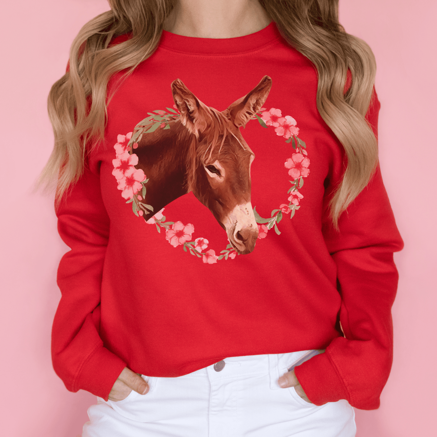Crew neck sweatshirt with a cute donkey surrounded by a pink flower wreath.