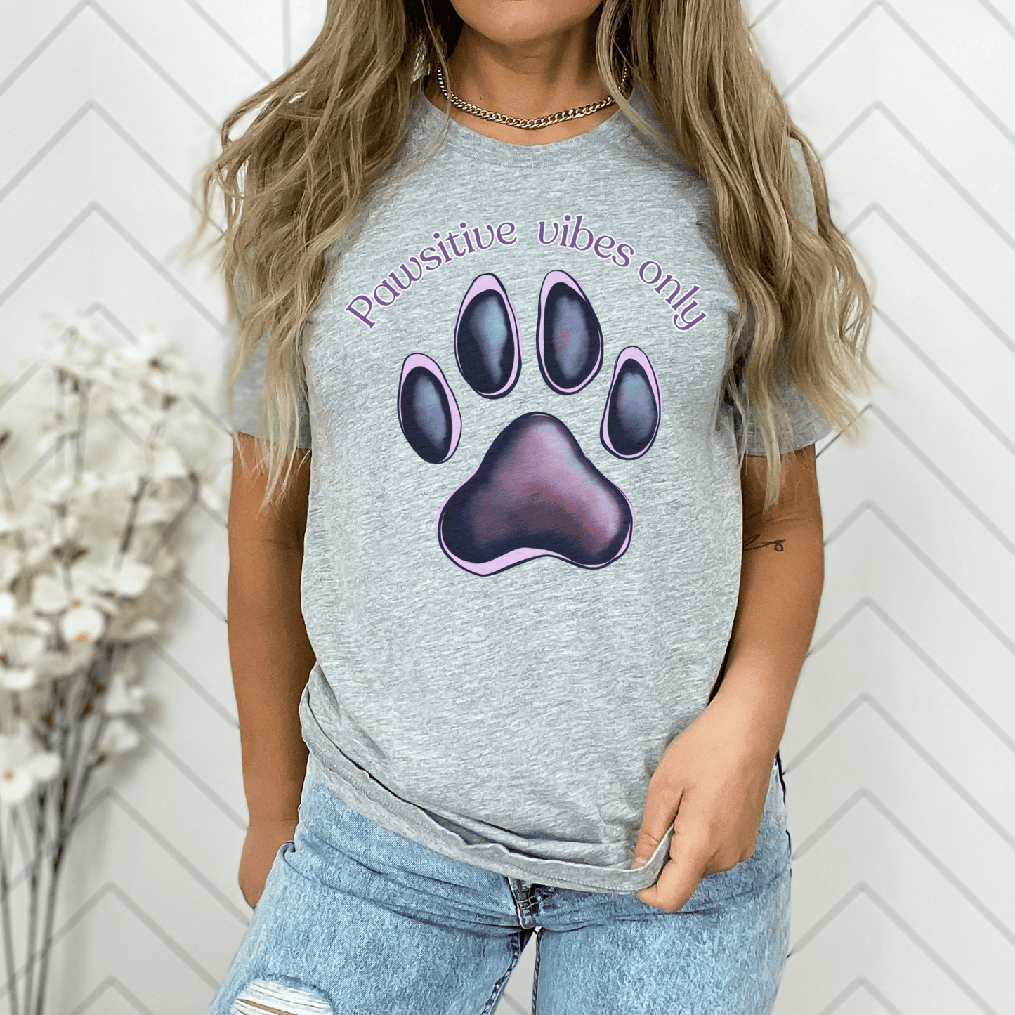 Embrace those pawsitive vibes with this adorable t-shirt featuring cute paw prints! This charming tee is perfect for any animal lover who wants to spread positivity wherever they go.