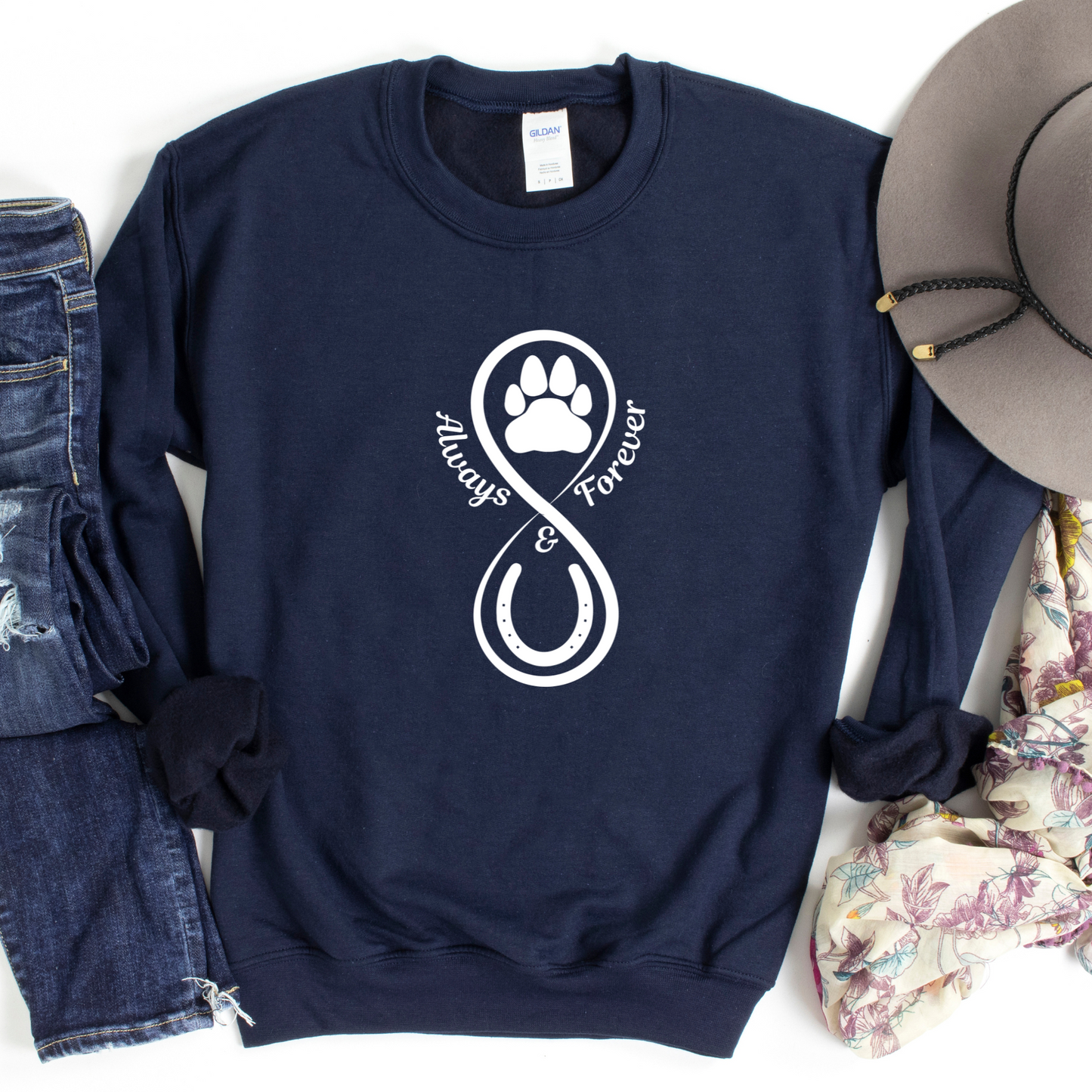 Our Always and Forever Pet Sweatshirt is a must-have for all pet parents! Featuring the words Always and Forever accompanied by an infinity symbol, horse shoe, and paw print, this shirt serves as a beautiful tribute to the treasured memories of your beloved pets.