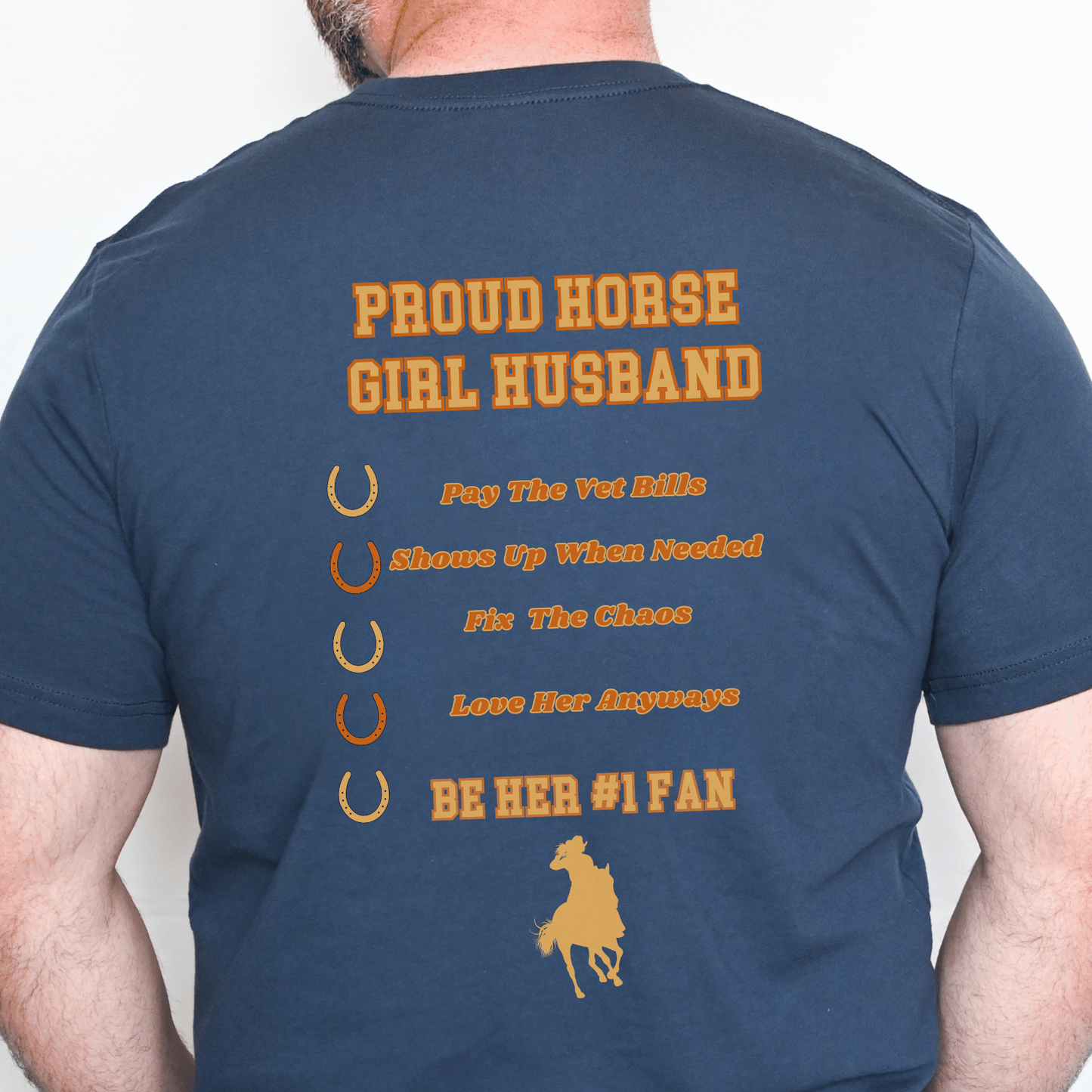 Navy blue t-shirt with yellow text and graphics on the back, worn by a person.