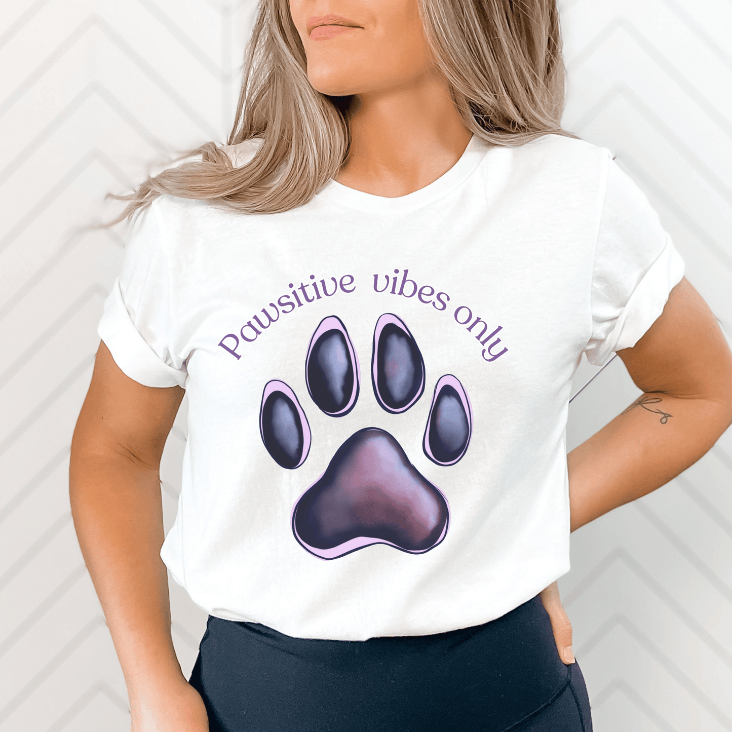 Embrace those pawsitive vibes with this adorable t-shirt featuring cute paw prints! This charming tee is perfect for any animal lover who wants to spread positivity wherever they go.