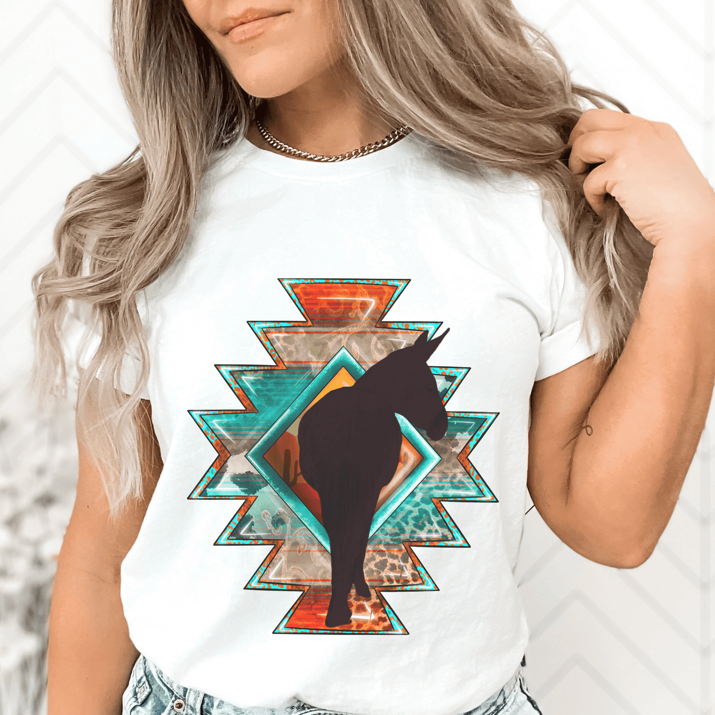 Southwestern-style graphic tee featuring a charming donkey silhouette! This shirt is perfect for animal lovers and those who embrace a farm, ranch, or country lifestyle. If you're a donkey enthusiast, this shirt is a must-have! Show off your love for these adorable animals or surprise a fellow donkey lover with a thoughtful gift from our donkey collection.