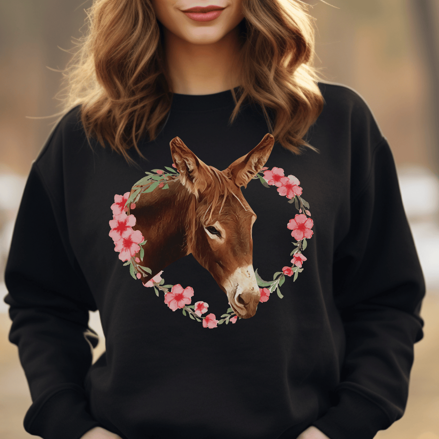Crew neck sweatshirt with a cute donkey surrounded by a pink flower wreath.