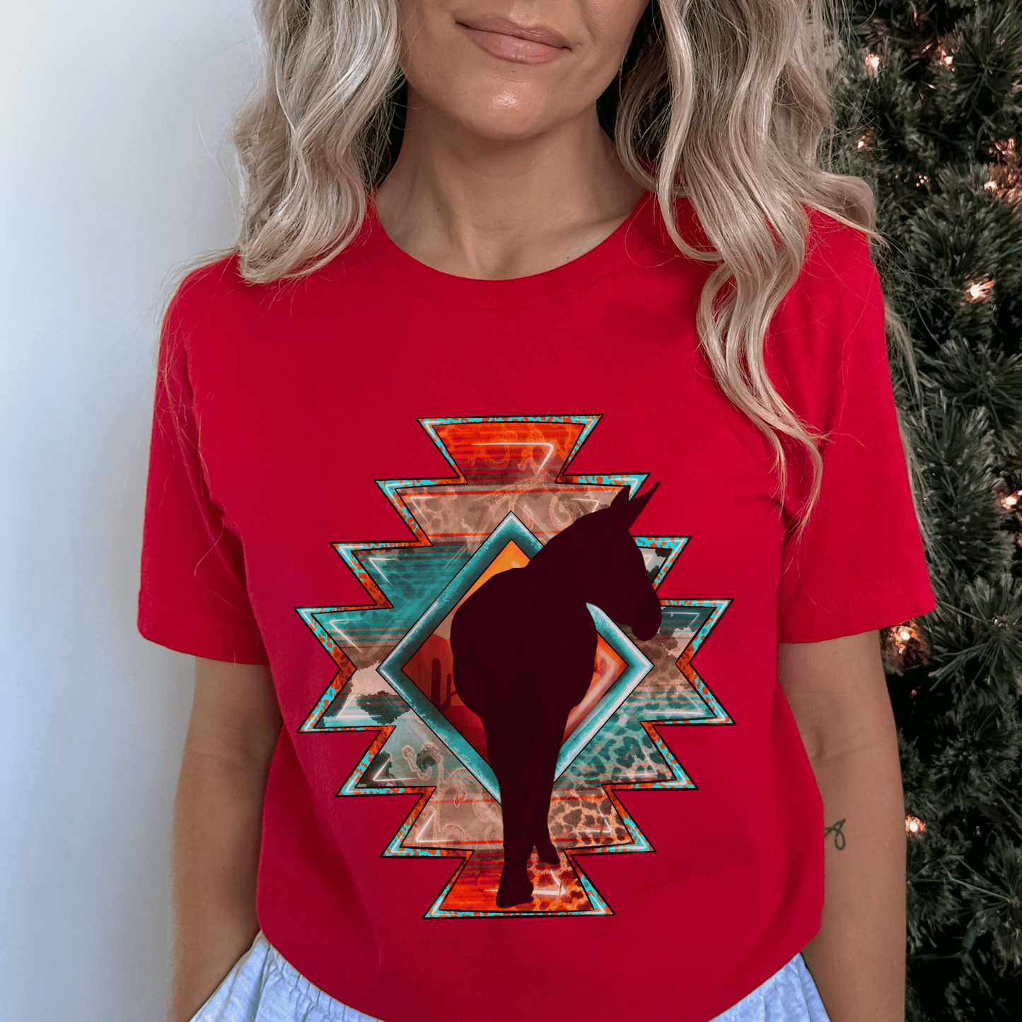 Southwestern-style graphic tee featuring a charming donkey silhouette! This shirt is perfect for animal lovers and those who embrace a farm, ranch, or country lifestyle. If you're a donkey enthusiast, this shirt is a must-have! Show off your love for these adorable animals or surprise a fellow donkey lover with a thoughtful gift from our donkey collection.