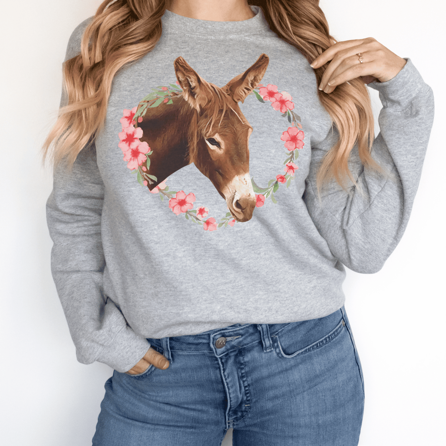 Crew neck sweatshirt with a cute donkey surrounded by a pink flower wreath.