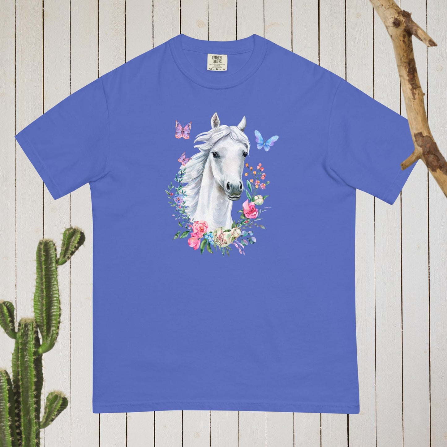 White Horse Boho Cowgirl t-shirt with a stunning cottagecore design featuring floral and butterflies in pastel colors. Made with high-quality materials, this shirt is both stylish and comfortable, perfect for any occasion. Whether you're dressing up for a night out or keeping it casual, this t-shirt is sure to turn heads