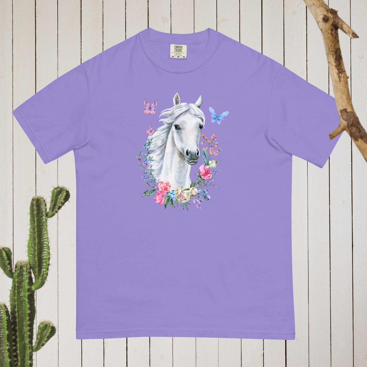White Horse Boho Cowgirl t-shirt with a stunning cottagecore design featuring floral and butterflies in pastel colors. Made with high-quality materials, this shirt is both stylish and comfortable, perfect for any occasion. Whether you're dressing up for a night out or keeping it casual, this t-shirt is sure to turn heads