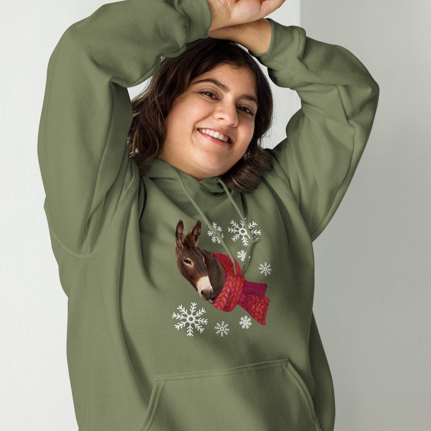 Winter Donkey with a scarf and snow flakes on a Military green hoodie sweatshirt