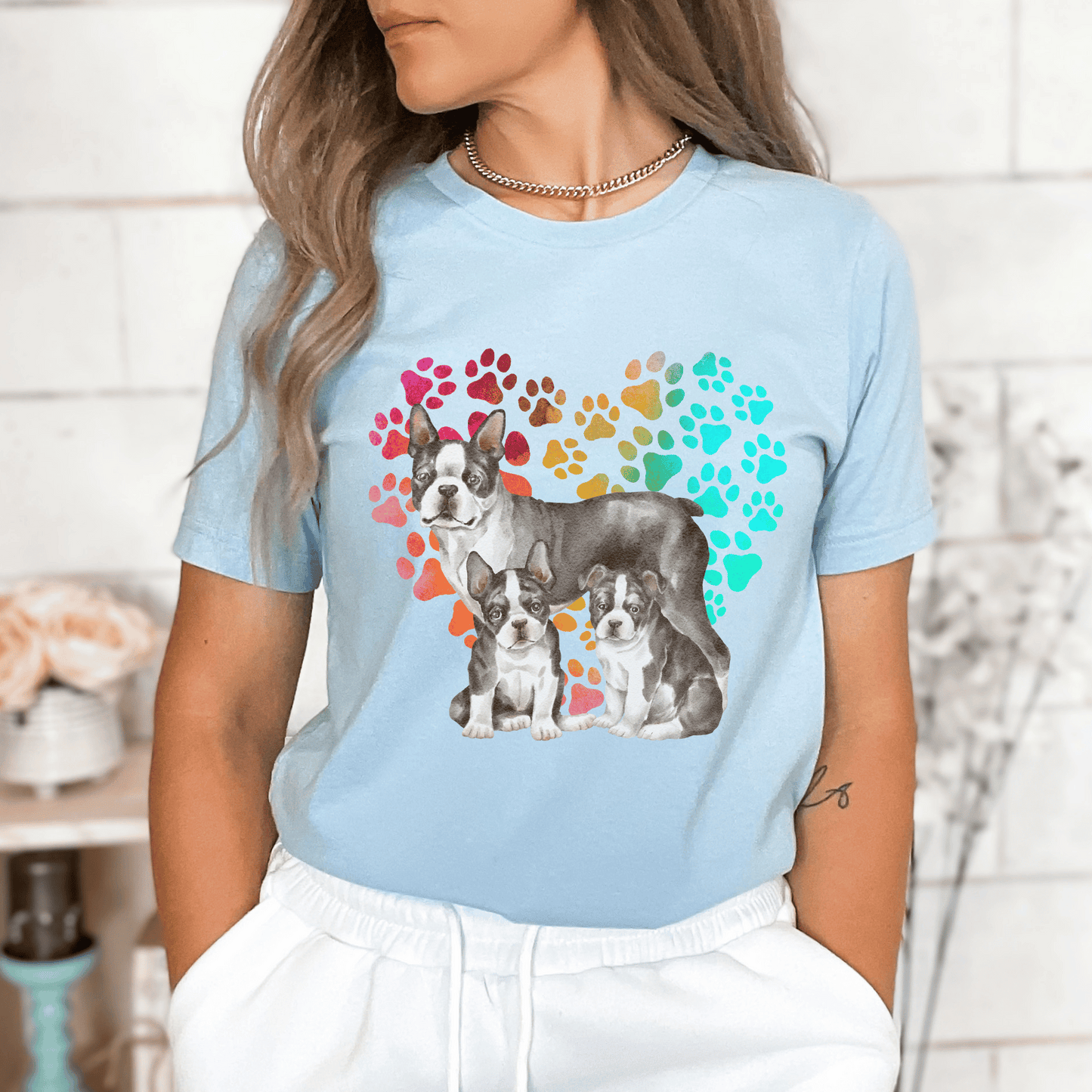 This Boston Terrier t-shirt features a paw print heart in the background, making it a unique and thoughtful gift for dog lovers, pet owners, and Boston Terrier moms. The shirt is perfect for anyone who wants to show off their love for their furry friend.