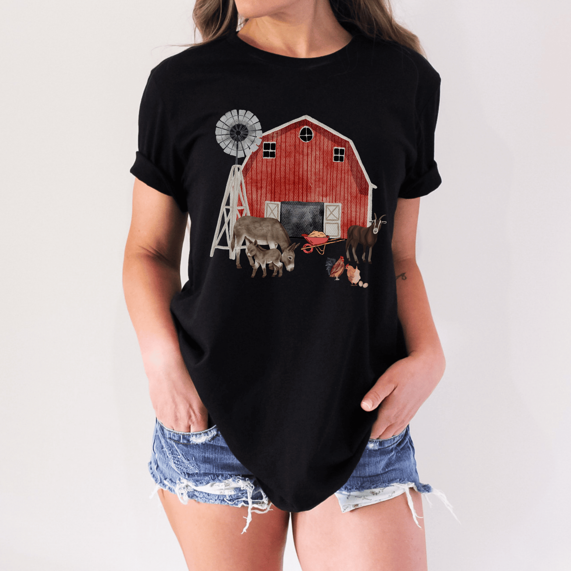 This cute farm shirt is great for anyone that loves the country and animals. The design features adorable farm animals and a red barn. This shirt is perfect gift for anyone who loves the outdoors and farms. Makes a great gift for animal lovers farmers, ranchers, and anyone in the countryside.