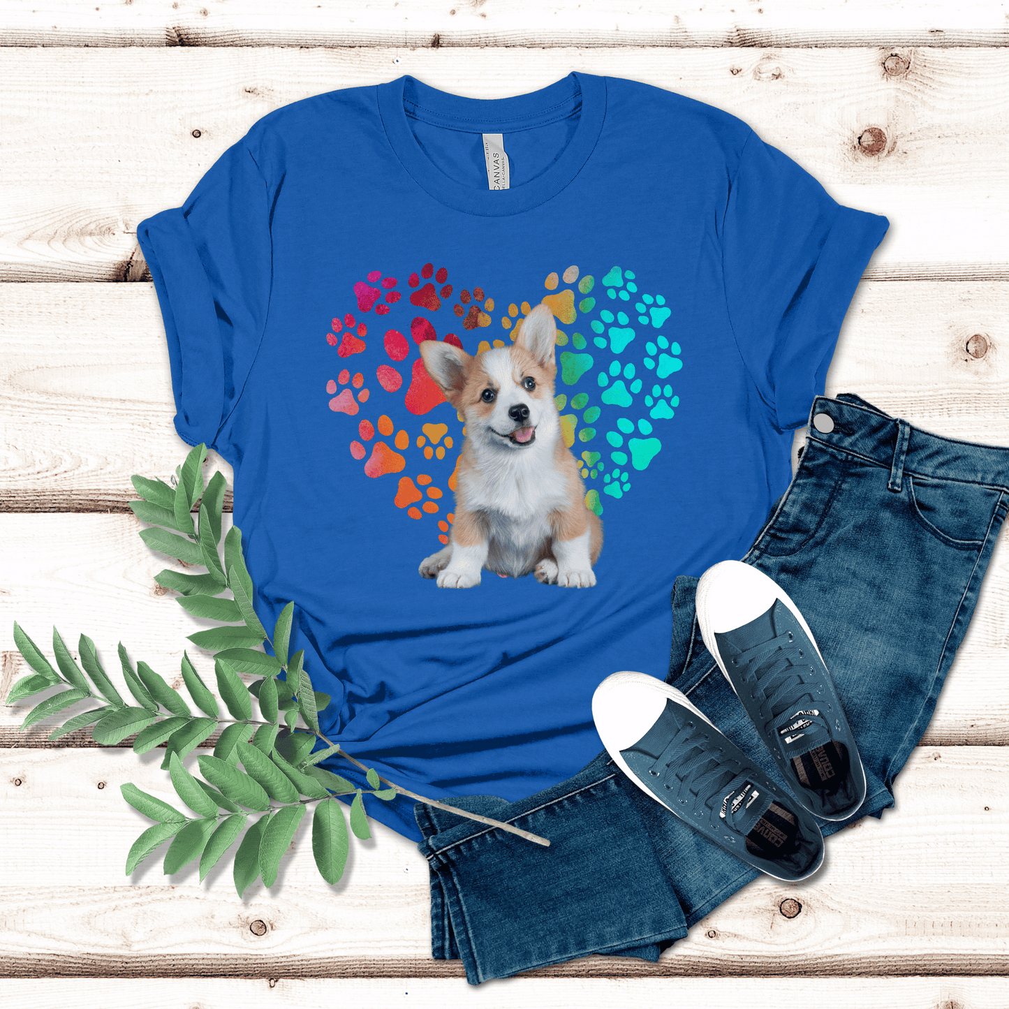 This Corgi Dog t-shirt features a paw print heart in the background, making it a unique and thoughtful gift for dog lovers, pet owners, and Corgi moms. The shirt is perfect for anyone who wants to show off their love for their furry friend.