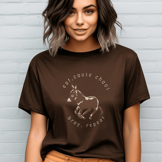  donkey t-shirt featuring a cute donkey design and the fun saying eat, cause chaos, bray, repeat. This whimsical and charming tee is perfect for donkey lovers
