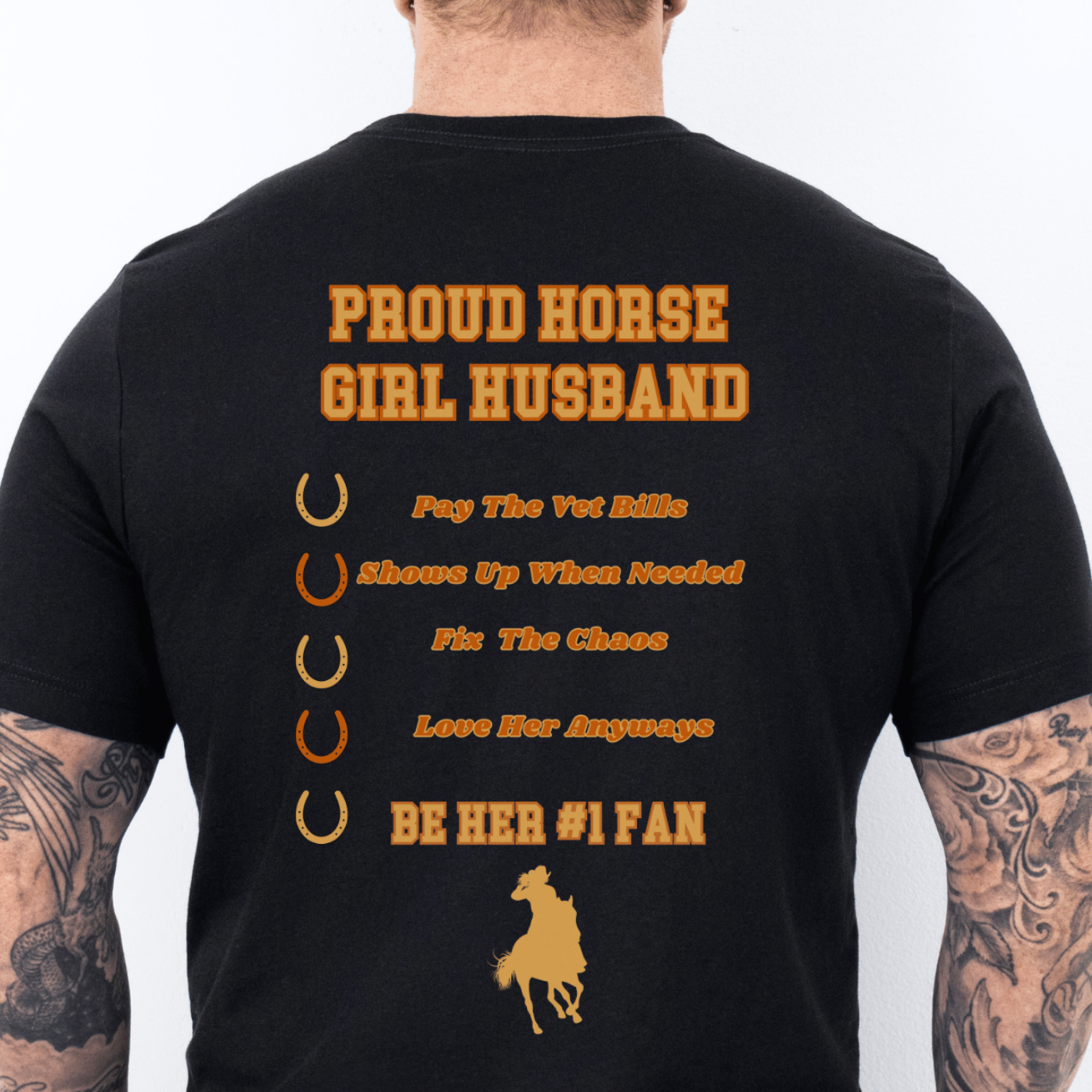 Black t-shirt with yellow text and graphics worn by a person, displayed against a white background.