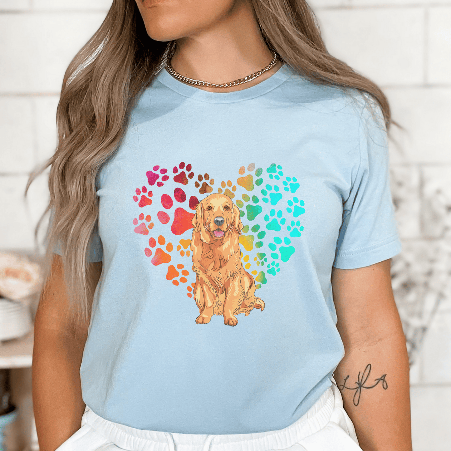 Show off your love for your Golden Retriever pup with this unique heart print t-shirt. An ideal pet parent top, this Golden Retriever t-shirt is the perfect gift for any dog mom or dog owner. Show your pooch that you care with this one-of-a-kind 