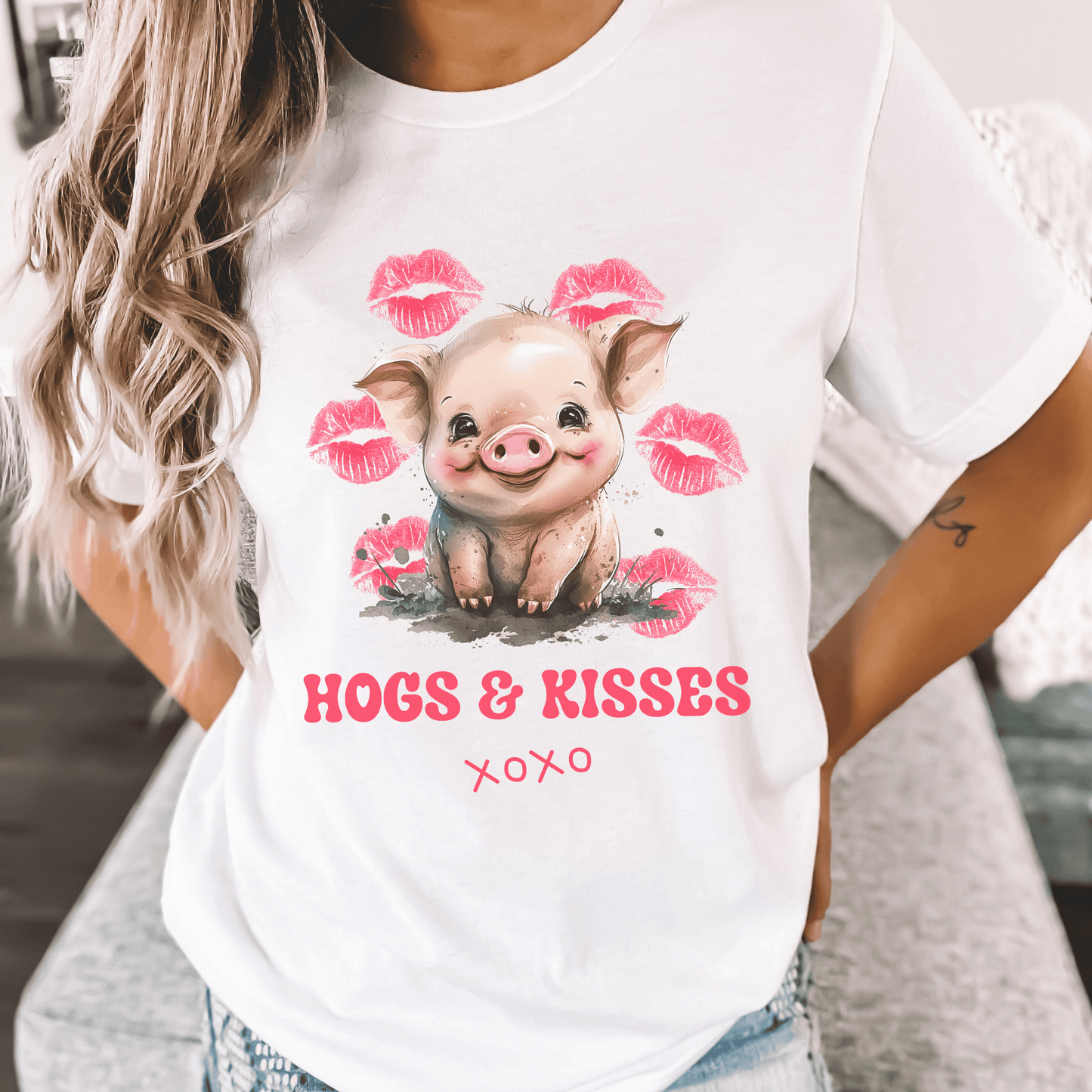 Look no further than this cute pig t-shirt that says "Hogs and Kisses". Whether you're a pig lover or just want to make a playful statement, this t-shirt is the perfect choice. Crafted from top-quality material, this shirt is both durable and comfortable, making it perfect for any occasion. So go ahead and add some fun to your wardrobe with this fun and flirty pig t-shirt.