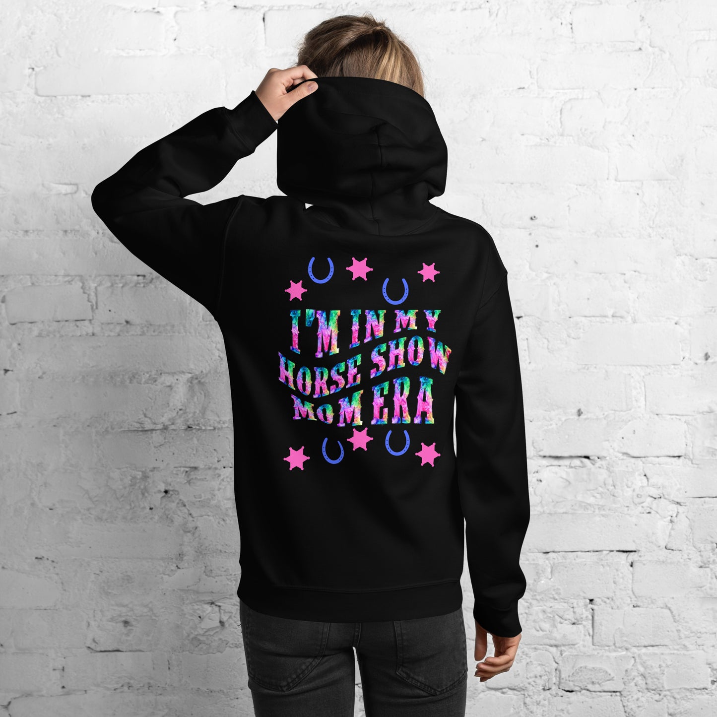 Be stylish while cheering on your equestrian superstar with our Horse Show Mom Era Hoodie. This cozy hoodie features a soft and comfortable fabric that will keep you cozy during those chilly show mornings and evenings.